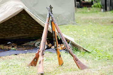 A tent with a gun on top