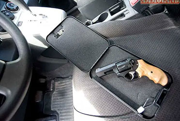 A gun case placed on the car seat, containing a firearm.