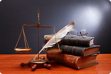 Justice scale in front of law books