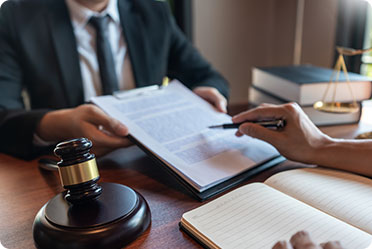 A judge discussing with a lawyer in courtroom