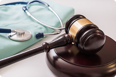 Image showing gavel & stethoscope symbolizing health & law